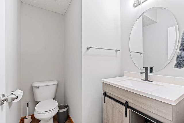 4107 Regent Ave N, Robbinsdale, MN 55422 - half bath with toilet, vanity, baseboards, and a textured ceiling