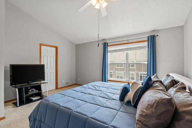 4107 Regent Ave N, Robbinsdale, MN 55422 - bedroom with baseboards, light colored carpet, a textured ceiling, ceiling fan, and vaulted ceiling