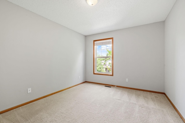 4107 Regent Ave N, Robbinsdale, MN 55422 - carpeted spare room featuring baseboards and a textured ceiling