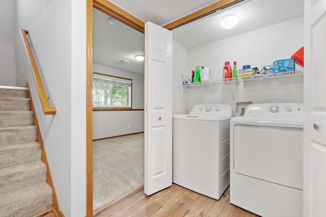 4107 Regent Ave N, Robbinsdale, MN 55422 - laundry room with separate washer and dryer, a textured ceiling, and light wood finished floors