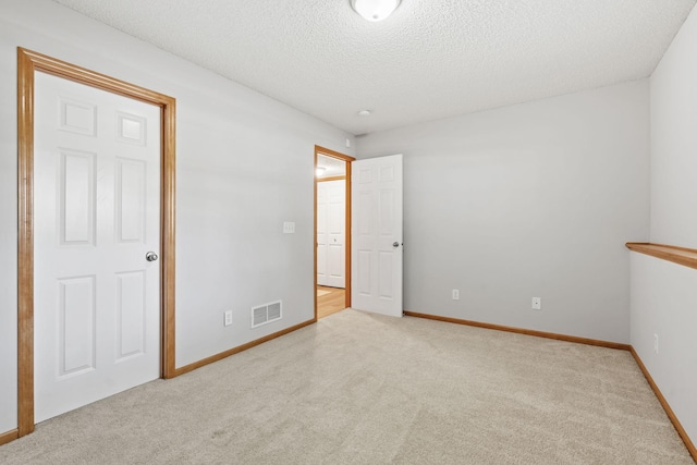 4107 Regent Ave N, Robbinsdale, MN 55422 - unfurnished bedroom featuring carpet flooring, a textured ceiling, and baseboards