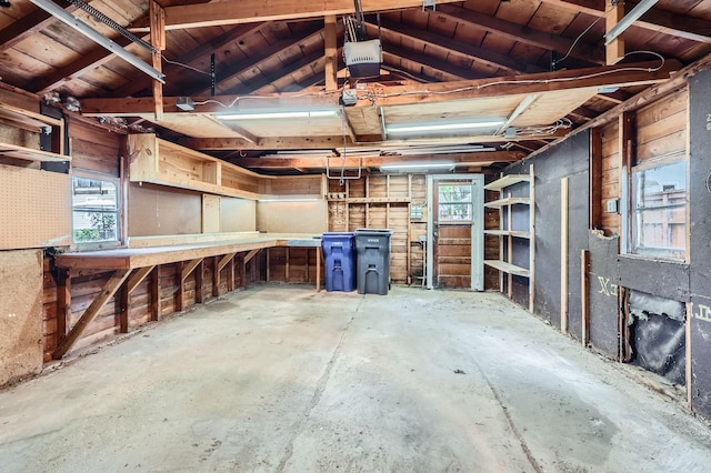 583 Cromwell Ave, Saint Paul, MN 55104 - garage featuring a garage door opener and a workshop area