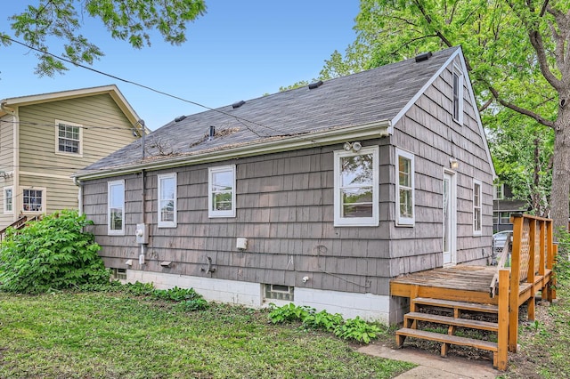 583 Cromwell Ave, Saint Paul, MN 55104 - view of home's exterior with a shingled roof and a wooden deck