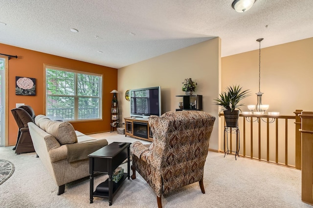 3661 Hazel Trl Unit H, Woodbury, MN 55129 - living area with light colored carpet, a chandelier, and a textured ceiling