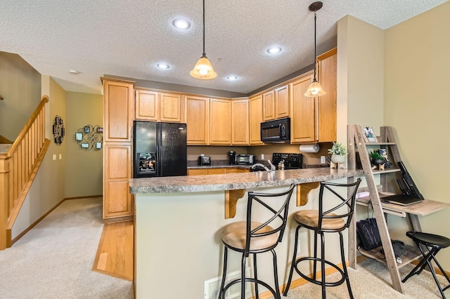 3661 Hazel Trl Unit H, Woodbury, MN 55129 - kitchen with black appliances, a peninsula, a textured ceiling, light carpet, and decorative light fixtures