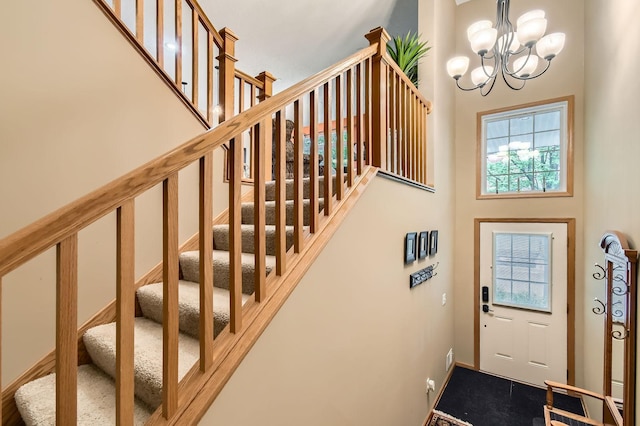 3661 Hazel Trl Unit H, Woodbury, MN 55129 - foyer entrance featuring stairway, a chandelier, and a high ceiling