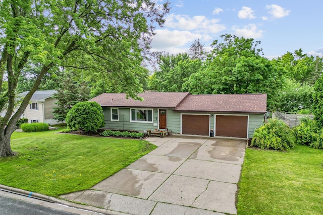 9301 Northwood Pkwy, New Hope, MN 55427 - ranch-style house featuring a garage, roof with shingles, concrete driveway, and a front yard