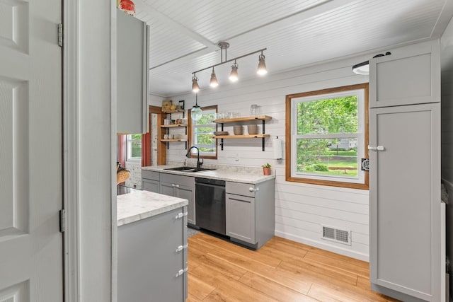 9301 Northwood Pkwy, New Hope, MN 55427 - kitchen featuring gray cabinets, stainless steel dishwasher, light wood-style floors, open shelves, and wood walls
