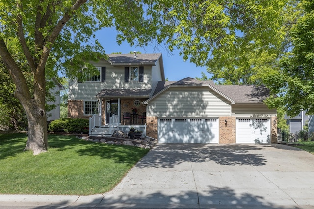 8821 Jonquil Ln N, Maple Grove, MN 55369 - traditional-style home featuring brick siding, an attached garage, driveway, a front lawn, and covered porch