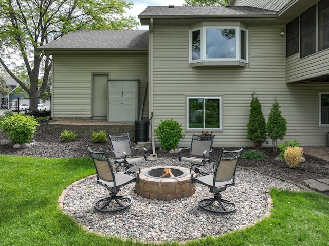 8821 Jonquil Ln N, Maple Grove, MN 55369 - view of patio featuring an outdoor fire pit