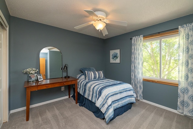 8821 Jonquil Ln N, Maple Grove, MN 55369 - carpeted bedroom with baseboards, arched walkways, a textured ceiling, and ceiling fan