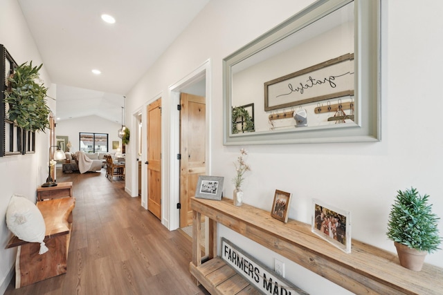 25822 Emerson Ct, Wyoming, MN 55092 - corridor with vaulted ceiling, wood finished floors, and recessed lighting