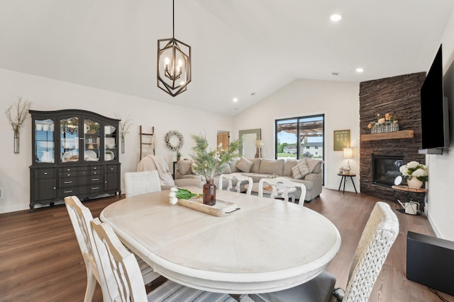 25822 Emerson Ct, Wyoming, MN 55092 - dining area with a stone fireplace, wood finished floors, recessed lighting, a chandelier, and baseboards