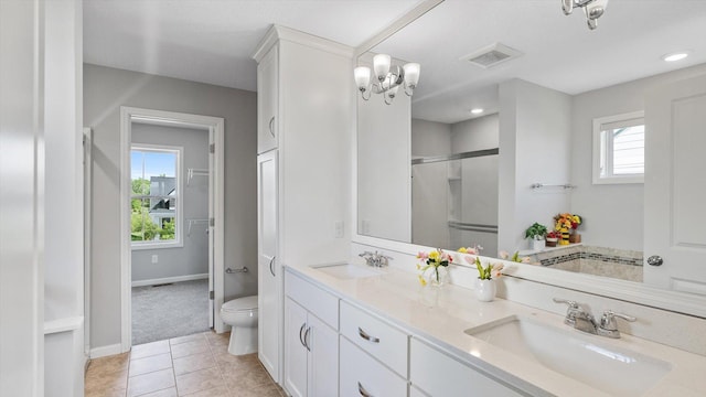 6455 Timber Arch Dr, Chaska, MN 55318 - full bathroom with plenty of natural light, toilet, double vanity, an enclosed shower, and recessed lighting