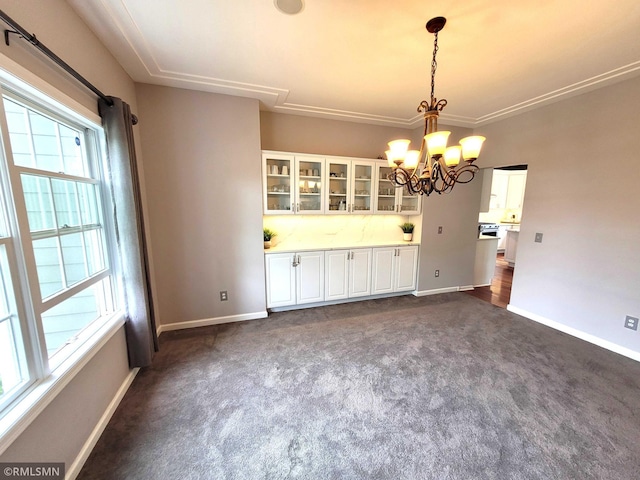10402 Indiana Ave N, Brooklyn Park, MN 55443 - unfurnished dining area with dark carpet, healthy amount of natural light, and baseboards