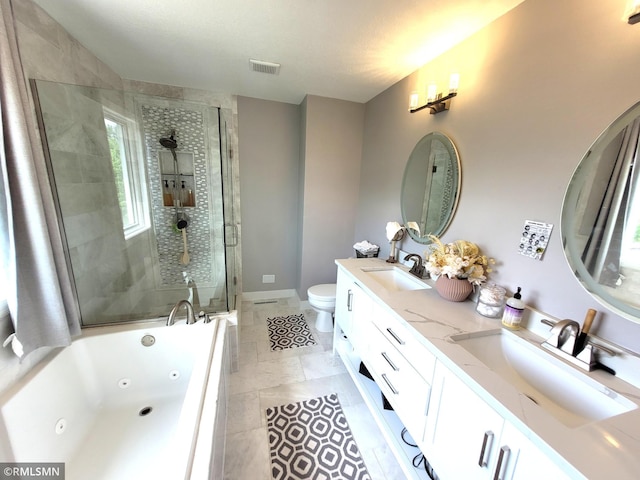 10402 Indiana Ave N, Brooklyn Park, MN 55443 - bathroom featuring double vanity, a stall shower, a jetted tub, toilet, and tile patterned flooring