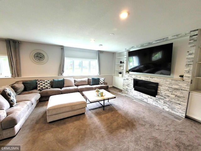 10402 Indiana Ave N, Brooklyn Park, MN 55443 - living room featuring built in shelves, carpet floors, a stone fireplace, and recessed lighting