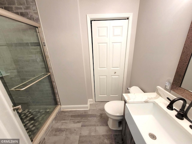 10402 Indiana Ave N, Brooklyn Park, MN 55443 - full bathroom featuring toilet, a shower stall, and vanity