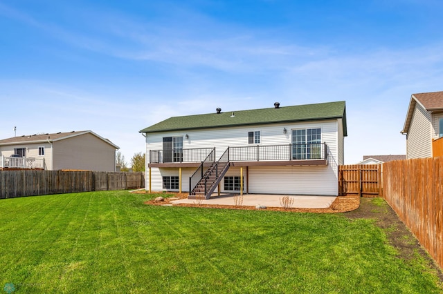 1586 Baywood Dr, Fargo, ND 58078 - back of property featuring a patio area, stairs, and a wooden deck