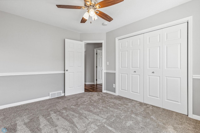 1586 Baywood Dr, Fargo, ND 58078 - unfurnished bedroom with carpet, a closet, baseboards, and a ceiling fan