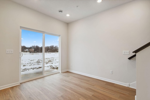 23217 Creekview Ct, Rogers, MN 55374 - unfurnished room with light wood-type flooring, baseboards, recessed lighting, and fire sprinkler in ceiling