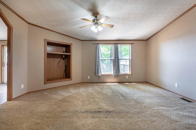 45379 Crystal Hills Dr, Lida Twp, MN 56572 - carpeted empty room with a ceiling fan, a textured ceiling, ornamental molding, baseboards, and arched walkways