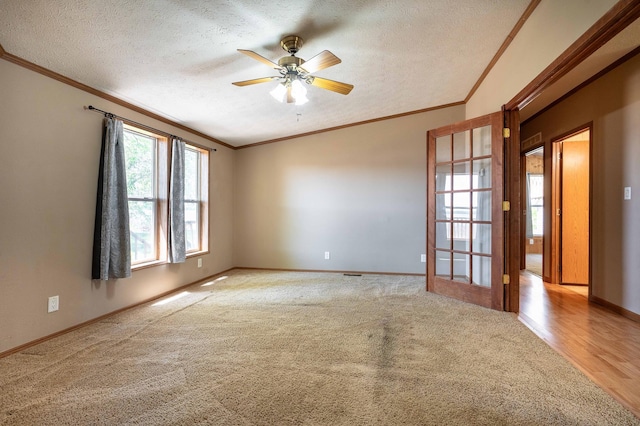 45379 Crystal Hills Dr, Lida Twp, MN 56572 - empty room featuring crown molding, carpet floors, a textured ceiling, a ceiling fan, and baseboards