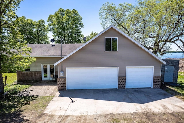 45379 Crystal Hills Dr, Lida Twp, MN 56572 - view of front of home with brick siding, french doors, and driveway