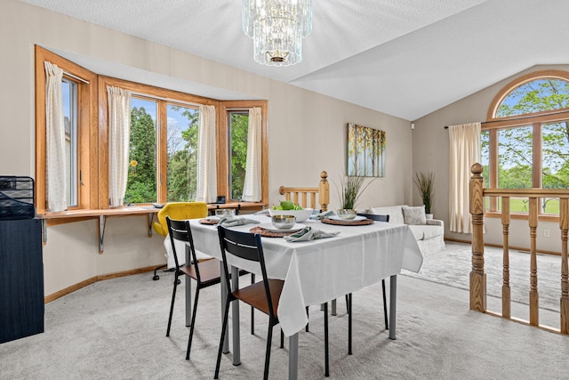 4985 142nd Ln NW, Ramsey, MN 55303 - dining space with light colored carpet, a chandelier, and lofted ceiling