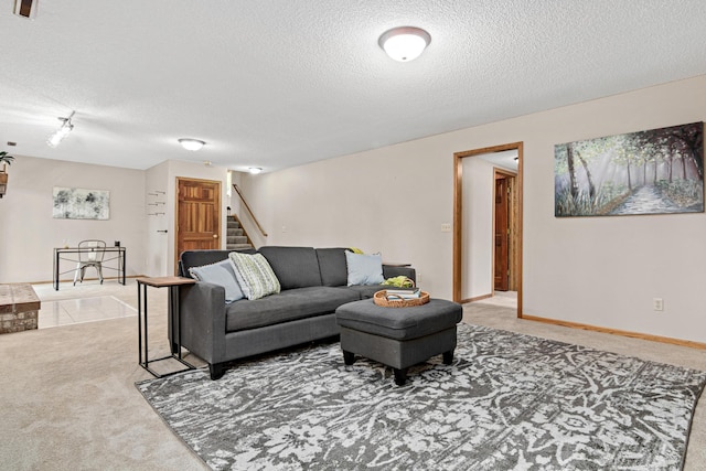 4985 142nd Ln NW, Ramsey, MN 55303 - living area featuring carpet flooring, a textured ceiling, and stairway