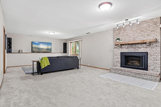 4985 142nd Ln NW, Ramsey, MN 55303 - living area with track lighting, a textured ceiling, carpet floors, and a brick fireplace
