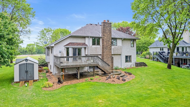 4985 142nd Ln NW, Ramsey, MN 55303 - back of property featuring a wooden deck, stairway, a shed, a chimney, and a yard