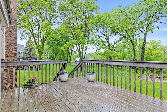4985 142nd Ln NW, Ramsey, MN 55303 - wooden terrace with a lawn