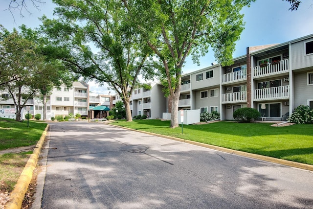 1601 Innsbruck Dr Unit 203, Fridley, MN 55432 - surrounding community with a residential view and a lawn