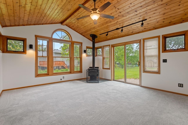 2908 81st Ave N, Brooklyn Park, MN 55444 - empty room with a wood stove, wooden ceiling, carpet floors, baseboards, and track lighting