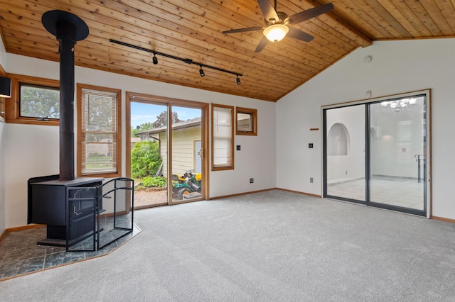 2908 81st Ave N, Brooklyn Park, MN 55444 - unfurnished living room featuring a wood stove, wooden ceiling, plenty of natural light, carpet, and a ceiling fan