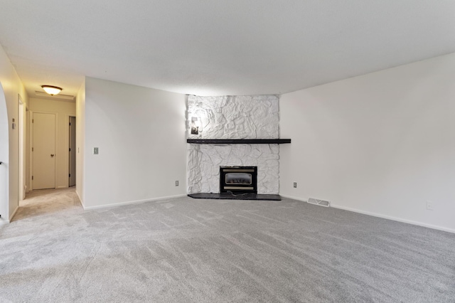 2908 81st Ave N, Brooklyn Park, MN 55444 - unfurnished living room featuring light colored carpet and baseboards