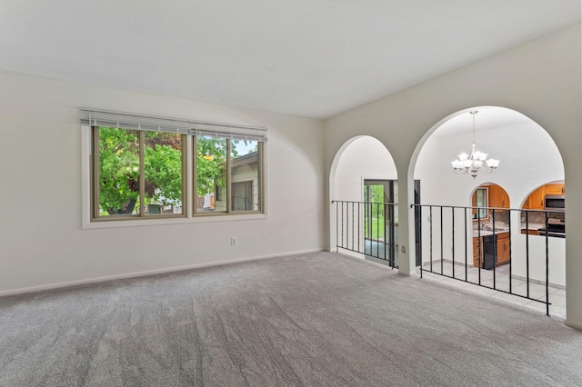 2908 81st Ave N, Brooklyn Park, MN 55444 - unfurnished room featuring a chandelier, carpet, and baseboards