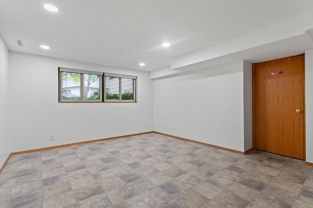 2908 81st Ave N, Brooklyn Park, MN 55444 - unfurnished room with baseboards, recessed lighting, and stone finish flooring