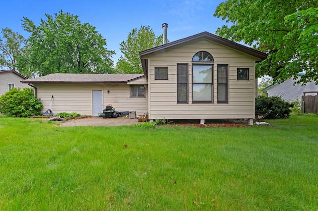 2908 81st Ave N, Brooklyn Park, MN 55444 - rear view of property with a lawn