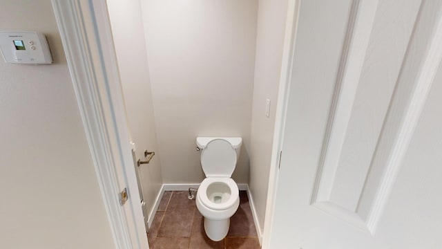 594 Charles Ave, Saint Paul, MN 55103 - bathroom with toilet, tile patterned flooring, and baseboards