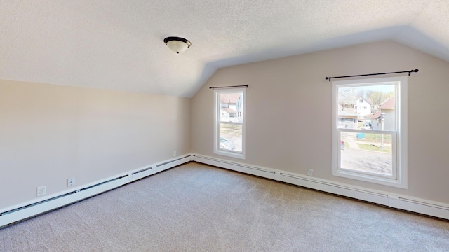 594 Charles Ave, Saint Paul, MN 55103 - additional living space with vaulted ceiling, carpet, a textured ceiling, and a baseboard heating unit