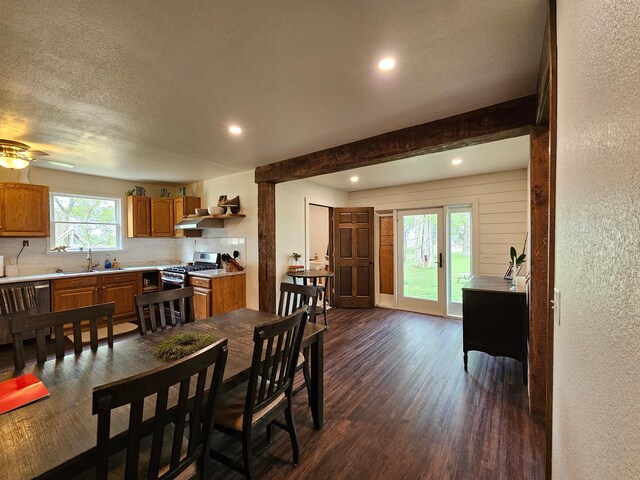 2032 70th Ave, Altona Twp, MN 56164 - dining area with dark wood-type flooring, recessed lighting, a textured wall, a ceiling fan, and a textured ceiling