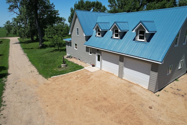 2032 70th Ave, Altona Twp, MN 56164 - view of front of house featuring driveway, a metal roof, and a garage