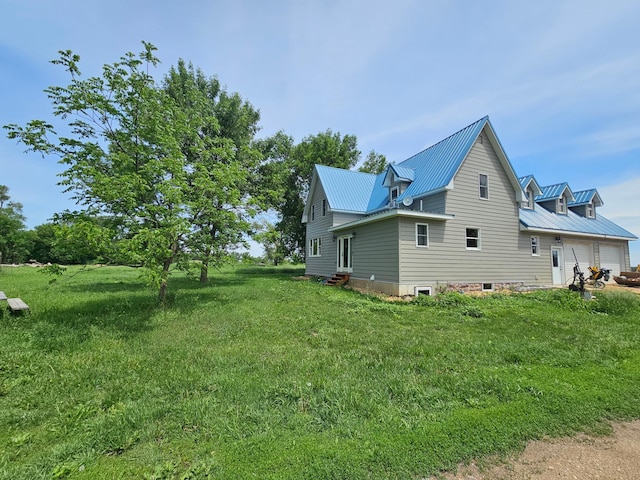 2032 70th Ave, Altona Twp, MN 56164 - view of side of property with a metal roof, a yard, and entry steps
