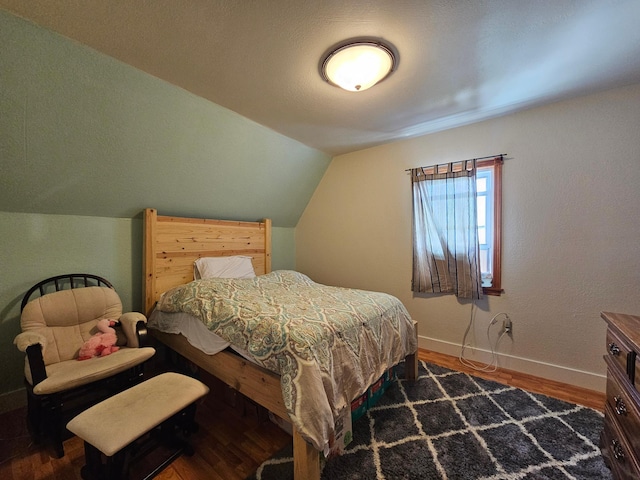 2032 70th Ave, Altona Twp, MN 56164 - bedroom featuring wood finished floors and lofted ceiling
