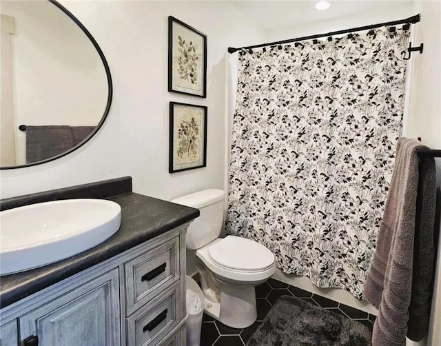 2011/2 10th Ave SE, Pipestone, MN 56164 - bathroom with tile patterned flooring, vanity, toilet, and curtained shower