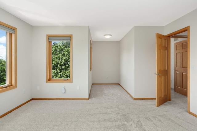 4301 Overlook Dr, Bloomington, MN 55437 - spare room with plenty of natural light, carpet floors, and baseboards