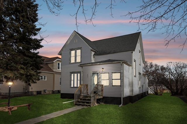 609 2nd Ave NE, Sleepy Eye, MN 56085 - back of house with a yard and roof with shingles