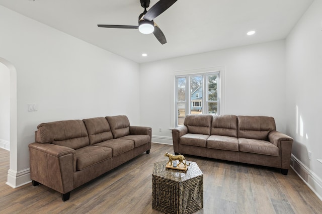 609 2nd Ave NE, Sleepy Eye, MN 56085 - living area with arched walkways, ceiling fan, wood finished floors, baseboards, and recessed lighting